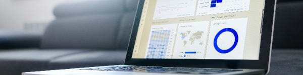Home Laptop screen displaying website analytics and graphs